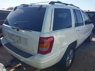 2004 Jeep Grand Cherokee Limited with VIN 1J8GW58N74C380204, listed as a IAAI auction lot 41756657 with 239,697 mi miles. Bid and sale history available at carsss.com. Image 4.