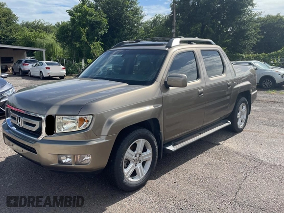 2009 Honda Ridgeline RTL with VIN 2HJYK16539H500759, listed as a Copart auction lot 63874225 with 123,508 mi miles and Clean title. Bid and sale history available at DreamBid. Image 2.