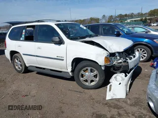 2006 GMC Envoy SLE with VIN 1GKDT13S662355509, listed as a IAAI auction lot 41628732 with 187,635 mi miles. Bid and sale history available at carsss.com. Image 1.