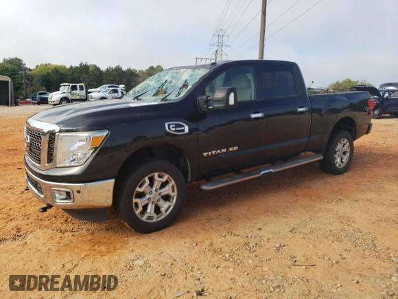 2016 Nissan Titan XD PRO-4X with VIN 1N6BA1F45GN506648, listed as a Copart auction lot 74381534 with 154,114 mi miles and Salvage Title. Bid and sale history available at carsss.com. Image 1.