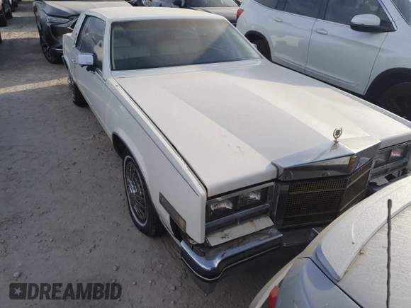 1985 Cadillac Eldorado z VIN 1G6EL5782FE630140, wystawiony jako Copart lot #76367454 z przebiegiem 29 850 mil mil oraz Szkody całkowita. Historia ofert i sprzedaży dostępna na DreamBid. Obrazek 5.