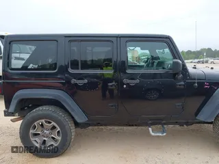 2015 Jeep Wrangler Unlimited Rubicon with VIN 1C4BJWFG7FL688728, listed as a IAAI auction lot 42054304 with 100,152 mi miles and . Bid and sale history available at DreamBid. Image 13.