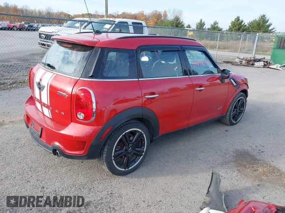 2015 MINI Cooper Countryman S with VIN WMWZC5C51FWP49282, listed as a IAAI auction lot 40698179 with 63,037 mi miles. Bid and sale history available at carsss.com. Image 4.