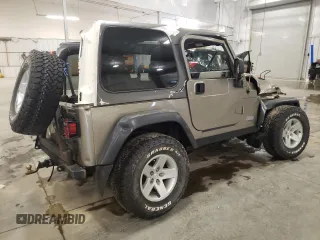 2004 Jeep Wrangler Rubicon z VIN 1J4FA69S44P784141, wystawiony jako Copart lot #55235305 z przebiegiem 125 564 mil mil oraz Szkoda całkowita • Salvage title. Historia ofert i sprzedaży dostępna na DreamBid. Obrazek 3.