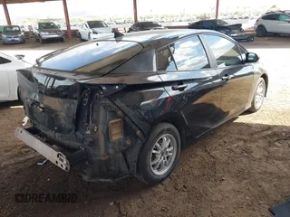 2016 Toyota Prius Two with VIN JTDKBRFUXG3503142, listed as a IAAI auction lot 42027700 with 185,319 mi miles. Bid and sale history available at carsss.com. Image 4.