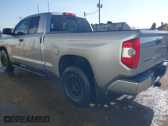 2014 Toyota Tundra SR with VIN 5TFRM5F13EX078411, listed as a IAAI auction lot 42702477 with 123,336 mi miles and . Bid and sale history available at DreamBid. Image 3.