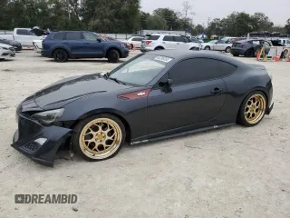 2016 Scion FR-S with VIN JF1ZNAA10G9700098, listed as a Copart auction lot 88208265 with 63,167 mi miles and Salvage Title. Bid and sale history available at carsss.com. Image 1.