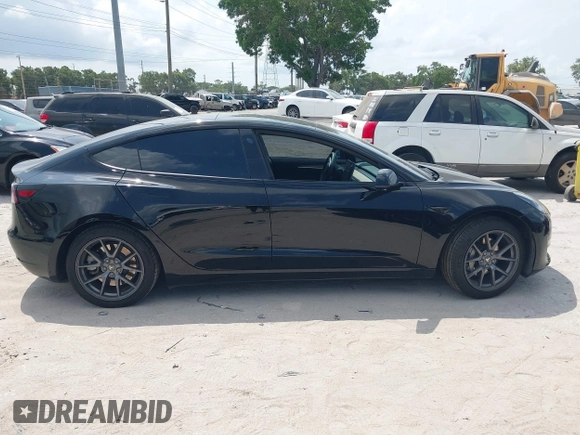 2023 Tesla Model 3 z VIN 5YJ3E1EA0PF571330, wystawiony jako IAAI lot #42198817 z przebiegiem 39 682 mil mil oraz . Historia ofert i sprzedaży dostępna na DreamBid. Obrazek 13.