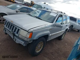 1995 Jeep Grand Cherokee Limited with VIN 1J4GZ78Y3SC649231, listed as a IAAI auction lot 41763953 with 140,889 mi miles. Bid and sale history available at carsss.com. Image 2.