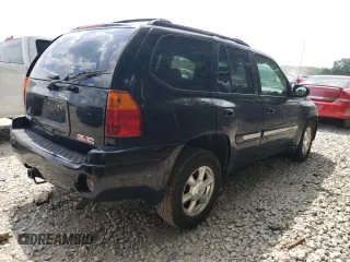 2004 GMC Envoy SLT with VIN 1GKDT13S042281050, listed as a Copart auction lot 60024304 with 267,205 mi miles and Salvage Title. Bid and sale history available at carsss.com. Image 3.