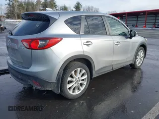 2014 Mazda CX-5 Grand Touring with VIN JM3KE2DY8E0304911, listed as a IAAI auction lot 41672197 with 77,523 mi miles. Bid and sale history available at carsss.com. Image 4.