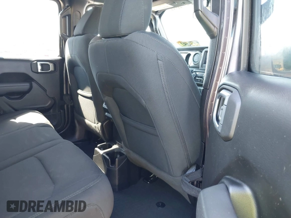 2022 Jeep Wrangler Unlimited Willys with VIN 1C4HJXDN1NW144112, listed as a IAAI auction lot 41867571 with 63,876 mi miles and . Bid and sale history available at DreamBid. Image 8.