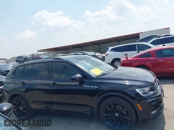 2021 Volkswagen Tiguan SE z VIN 3VV3B7AX0MM047478, wystawiony jako IAAI lot #42144239 z przebiegiem 55 468 mil mil oraz . Historia ofert i sprzedaży dostępna na DreamBid. Obrazek 14.