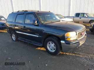 2003 GMC Yukon SLT with VIN 1GKEC13Z53R279530, listed as a IAAI auction lot 41451412 with 308,872 mi miles. Bid and sale history available at carsss.com. Image 1.