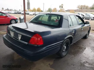 2001 Ford Crown Victoria Police Pkg Police Interceptor with VIN 2FAFP71WX1X127347, listed as a IAAI auction lot 41134745 with 161,180 mi miles. Bid and sale history available at carsss.com. Image 4.