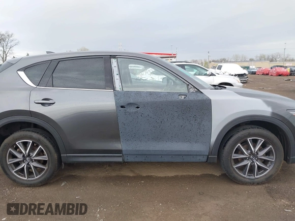 2017 Mazda CX-5 Grand Touring with VIN JM3KFBDL3H0143194, listed as a IAAI auction lot 42049258 with 74,159 mi miles. Bid and sale history available at carsss.com. Image 13.