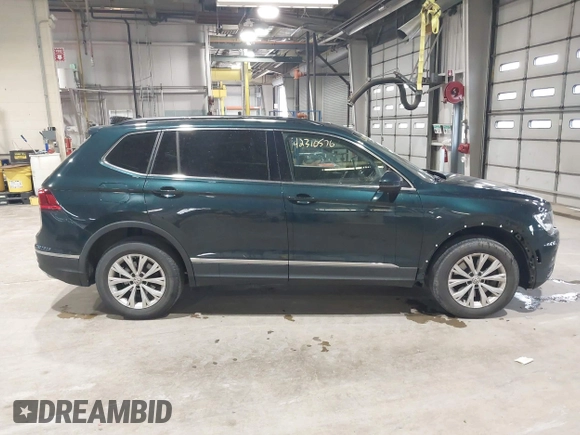 2018 Volkswagen Tiguan SEL with VIN 3VV2B7AX8JM113976, listed as a IAAI auction lot 42310576 with 100,319 mi miles and . Bid and sale history available at DreamBid. Image 13.