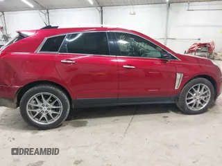 2014 Cadillac SRX Performance Collection z VIN 3GYFNCE30ES596415, wystawiony jako IAAI lot #42329771 z przebiegiem 71 620 mil mil oraz . Historia ofert i sprzedaży dostępna na DreamBid. Obrazek 13.