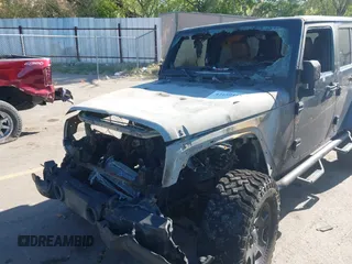 2011 Jeep Wrangler Unlimited Rubicon with VIN 1J4BA6H16BL615945, listed as a IAAI auction lot 42159418 with Not provided miles and . Bid and sale history available at DreamBid. Image 6.