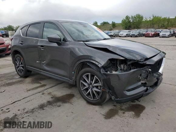2018 Mazda CX-5 Touring z VIN JM3KFBCM4J0349687, wystawiony jako Copart lot #55857945 z przebiegiem Nie podano mil oraz Szkoda całkowita • Salvage title. Historia ofert i sprzedaży dostępna na DreamBid. Obrazek 4.