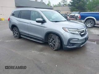 2020 Honda Pilot Touring 8-Passenger z VIN 5FNYF6H91LB042626, wystawiony jako IAAI lot #42249440 z przebiegiem 57 429 mil mil oraz . Historia ofert i sprzedaży dostępna na DreamBid. Obrazek 1.