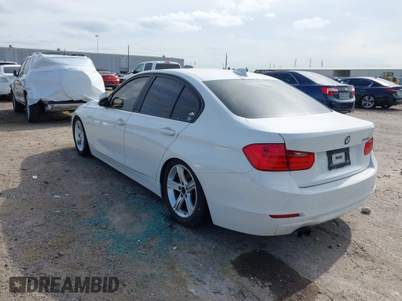 2012 BMW 3 Series 328i with VIN WBA3A5C53CF341664, listed as a IAAI auction lot 41991169 with 168,808 mi miles and . Bid and sale history available at carsss.com. Image 3.