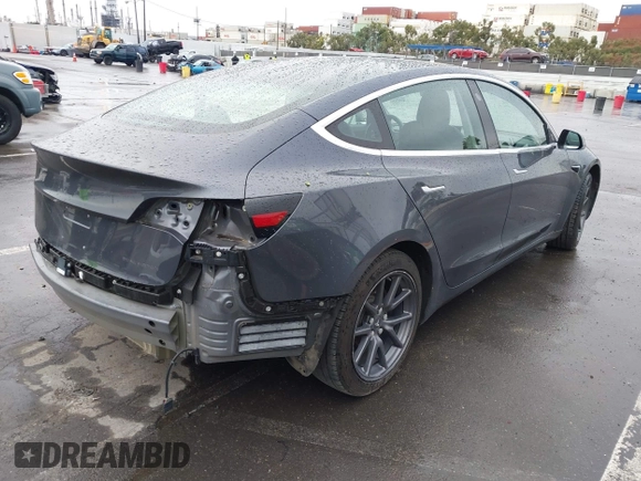 2018 Tesla Model 3 Long Range Battery with VIN 5YJ3E1EB7JF114305, listed as a IAAI auction lot 41765994 with 76,945 mi miles and . Bid and sale history available at DreamBid. Image 4.