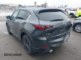 2022 Mazda CX-5 2.5 Turbo with VIN JM3KFBAY8N0647204, listed as a IAAI auction lot 41567490 with 40,396 mi miles and . Bid and sale history available at carsss.com. Image 3.