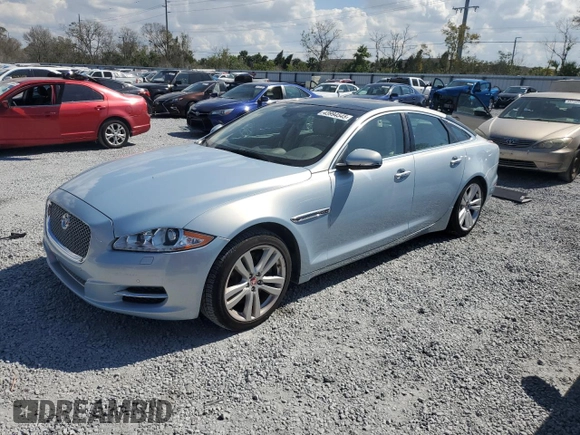 2014 Jaguar XJ with VIN SAJWA1CZ4E8V71167, listed as a Copart auction lot 43994545 with 69,682 mi miles and Salvage Title. Bid and sale history available at DreamBid. Image 1.