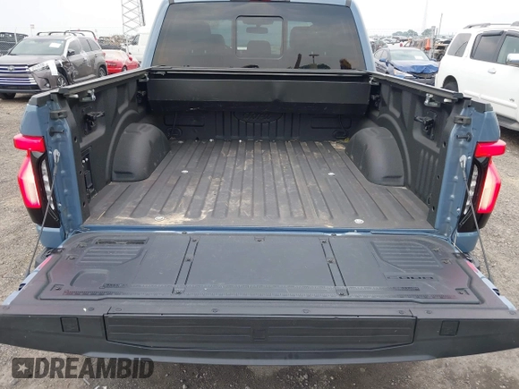 2023 Ford F-150 Lightning Pro with VIN 1FT6W1EVXPWG53591, listed as a IAAI auction lot 42249385 with 17,892 mi miles and . Bid and sale history available at DreamBid. Image 21.