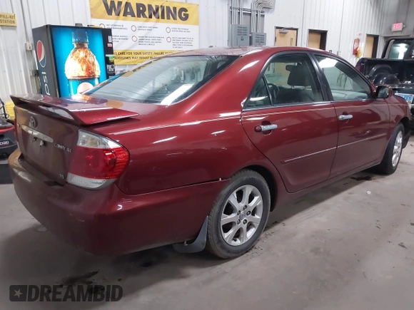 2005 Toyota Camry LE with VIN 4T1BF30KX5U099450, listed as a IAAI auction lot 41670099 with Not Provided miles and . Bid and sale history available at DreamBid. Image 4.