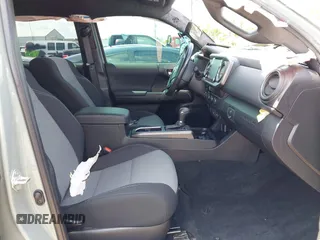 2023 Toyota Tacoma SR with VIN 3TMCZ5AN1PM581266, listed as a IAAI auction lot 42371395 with 32,582 mi miles and . Bid and sale history available at DreamBid. Image 5.