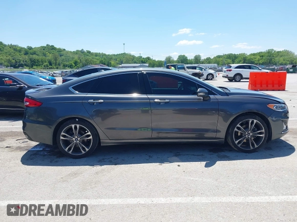 2020 Ford Fusion Titanium with VIN 3FA6P0K96LR173971, listed as a IAAI auction lot 42232469 with 82,474 mi miles and . Bid and sale history available at DreamBid. Image 14.