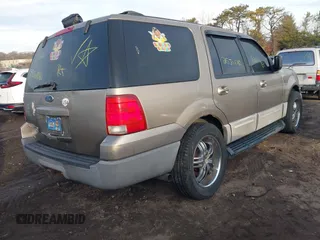 2003 Ford Expedition XLT Value with VIN 1FMPU16W83LA58988, listed as a IAAI auction lot 41627386 with 999,999 mi miles. Bid and sale history available at carsss.com. Image 4.