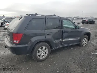 2010 Jeep Grand Cherokee Laredo with VIN 1J4RR4GT7AC120604, listed as a Copart auction lot 84257724 with 60,827 mi miles and Salvage Title. Bid and sale history available at carsss.com. Image 3.
