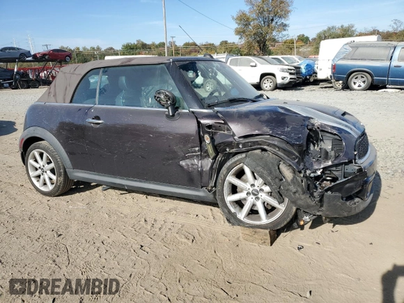 2014 MINI Convertible S with VIN WMWZP3C55ET298172, listed as a Copart auction lot 76977114 with 119,138 mi miles and Salvage title. Bid and sale history available at DreamBid. Image 4.
