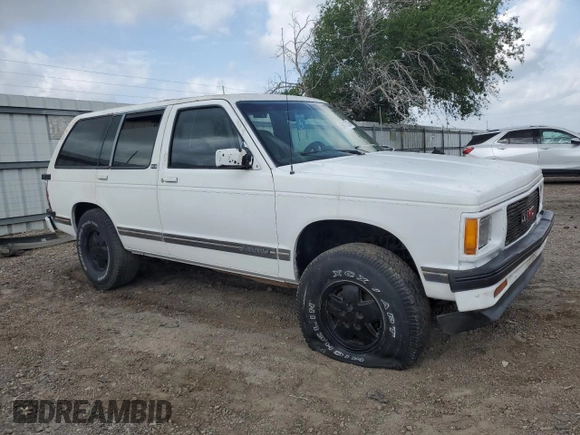 1994 GMC Jimmy Diamond Edition Luxury z VIN 1GKDT13W5R2503916, wystawiony jako Copart lot #54717215 z przebiegiem 99 991 mil mil oraz Szkoda całkowita • Salvage title. Historia ofert i sprzedaży dostępna na DreamBid. Obrazek 4.