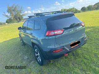 2015 Jeep Cherokee Trailhawk with VIN 1C4PJMBS1FW529559, listed as a Copart auction lot 66581755 with 113,915 mi miles and Salvage title. Bid and sale history available at DreamBid. Image 3.