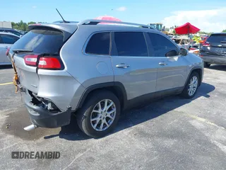 2014 Jeep Cherokee Latitude with VIN 1C4PJLCS6EW103423, listed as a IAAI auction lot 40118289 with 112,120 mi miles and . Bid and sale history available at DreamBid. Image 4.