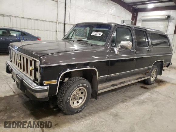 1991 GMC Suburban z VIN 1GKEV16K5MF500359, wystawiony jako Copart lot #81125224 z przebiegiem 177 181 mil mil oraz Czysty tytuł • Clean title. Historia ofert i sprzedaży dostępna na DreamBid. Obrazek 1.
