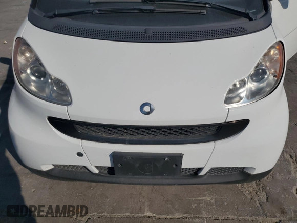 2012 Smart fortwo Pure z VIN WMEEJ3BA5CK540092, wystawiony jako Copart lot #75701964 z przebiegiem 59 355 mil mil oraz Szkody całkowita. Historia ofert i sprzedaży dostępna na DreamBid. Obrazek 11.