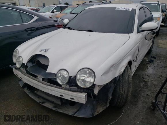 2003 Jaguar S-Type with VIN SAJEA01T43FM87170, listed as a Copart auction lot 41265364 with 79,273 mi miles and Non Repairable. Bid and sale history available at DreamBid. Image 1.