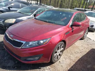 2013 Kia Optima SX w/Limited Pkg with VIN 5XXGR4A66DG137530, listed as a IAAI auction lot 41940486 with 124,605 mi miles. Bid and sale history available at carsss.com. Image 2.