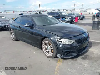 2014 BMW 4 Series 428i with VIN WBA3N7C55EF719504, listed as a IAAI auction lot 41403957 with 98,882 mi miles and . Bid and sale history available at carsss.com. Image 1.