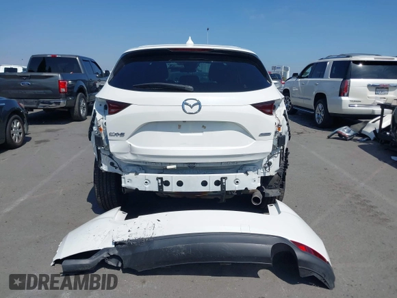 2018 Mazda CX-5 Touring with VIN JM3KFACM0J0416716, listed as a IAAI auction lot 42150121 with 61,332 mi miles and . Bid and sale history available at carsss.com. Image 17.