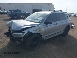2022 Volkswagen Tiguan SE R-Line Black with VIN 3VV8B7AX7NM030703, listed as a IAAI auction lot 42135974 with 57,116 mi miles and . Bid and sale history available at DreamBid. Image 2.
