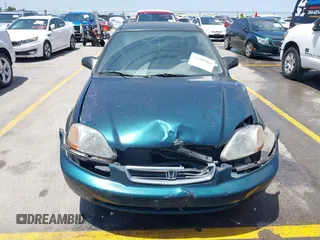 1998 Honda Civic LX z VIN 1HGEJ6671WL011642, wystawiony jako IAAI lot #42308904 z przebiegiem 77 380 mil mil oraz . Historia ofert i sprzedaży dostępna na DreamBid. Obrazek 6.