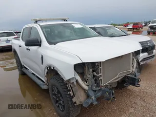2024 Ford Ranger XLT with VIN 1FTER4HH8RLE21828, listed as a IAAI auction lot 42205087 with 61,159 mi miles and . Bid and sale history available at DreamBid. Image 1.