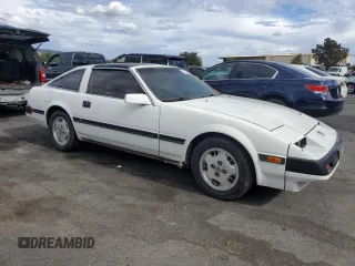 1985 Nissan 300ZX z VIN JN1HZ16S9FX050874, wystawiony jako Copart lot #72283704 z przebiegiem 139 895 mil mil oraz Tytuł czysty. Historia ofert i sprzedaży dostępna na DreamBid. Obrazek 4.