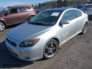 2009 Scion tC with VIN JTKDE167590289105, listed as a IAAI auction lot 41761187 with 195,242 mi miles. Bid and sale history available at carsss.com. Image 2.